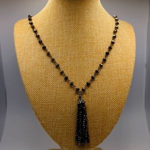 Antique Silver with antique bronze dangle on a nice long necklace